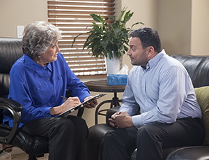 Man talking to therapist.