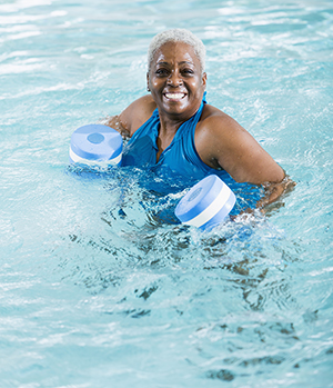 Woman exercising in pool.