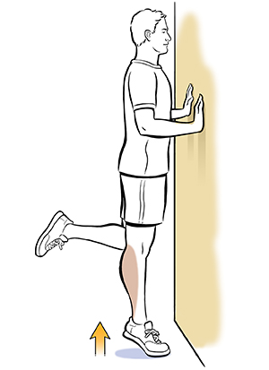 Person next to wall doing single-leg heel raise exercise.