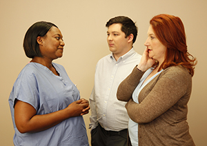 Man and woman talking to healthcare provider.