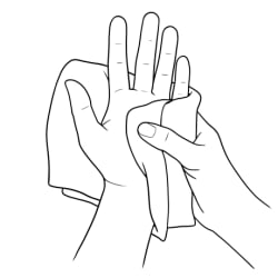 Hands drying with towel.
