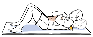 Man lying down doing partial sit-up exercise.