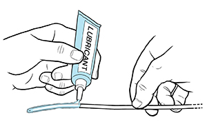 Hands applying lubricant to urinary catheter.