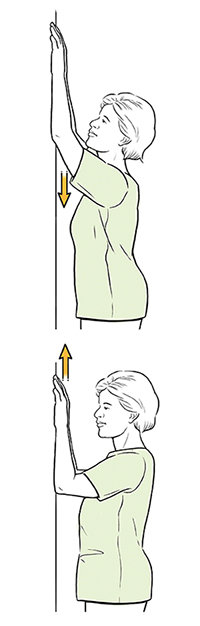 Woman doing wall climb exercise.